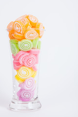 Jelly sweet, flavor fruit, candy dessert colorful in glass on wh