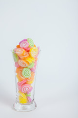 Jelly sweet, flavor fruit, candy dessert colorful in glass on wh