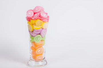 Jelly sweet, flavor fruit, candy dessert colorful in glass on wh
