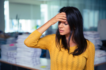 Fototapeta premium Businesswoman having headache in office