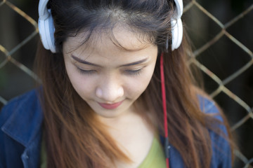 Beautiful girl listening to music.