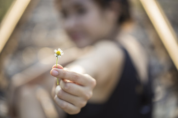 Beautiful girl holding Flower.