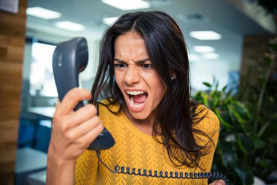 Angry Businesswoman Shouting On Phone