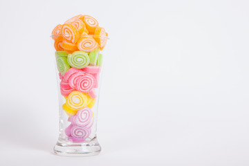 Jelly sweet, flavor fruit, candy dessert colorful in glass on wh