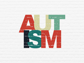 Healthcare concept: Autism on wall background