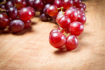 Red Grapes on a wooden table