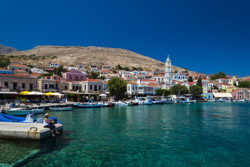 Fototapeta na wymiar Multi-coloured buildings of Halki Island (Chalki)