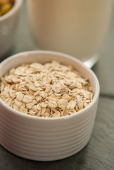 Bowl of oat flakes close up