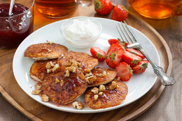 Breakfast with pancakes, fresh strawberries and cream