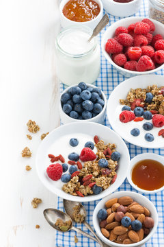 breakfast with granola, fresh berries, honey and yogurt 