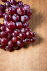 Red Grapes on a wooden table