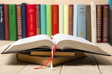 Open book, hardback books on wooden table. Back to school. Copy space