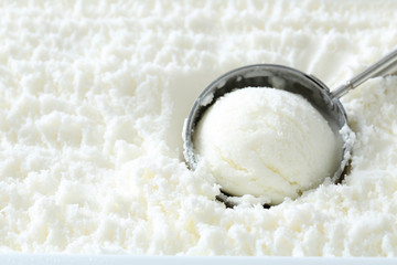 White ice cream scooped out from container