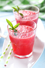 Fresh watermelon juice in the glass on wooden table