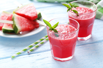Fresh watermelon juice in the glass on wooden table