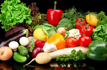 Group of different vegetables on black background