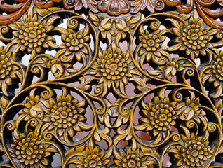 Pattern of flower carved on wood background