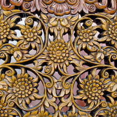 Pattern of flower carved on wood background