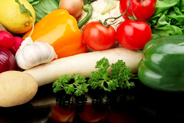 Group of different vegetables on black
