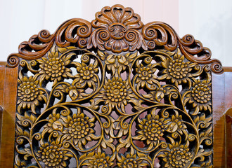 Pattern of flower carved on wood background