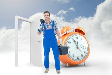 Composite image of portrait of plumber