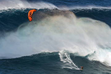 MAUI, HAWAII, USA - DECEMBER 15, 2013: kite surfer is riding a b