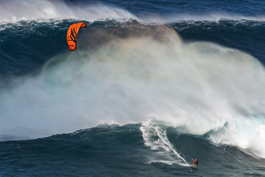 MAUI, HAWAII, USA - DECEMBER 15, 2013: kite surfer is riding a b