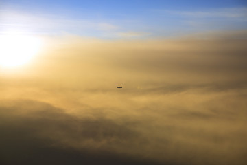 Cruising aircraft at sunset
