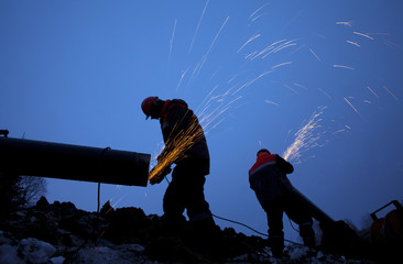 Workers working on the construction of the pipeline