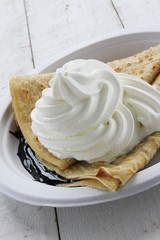 fresh crepes with cream and chocolate sauce
