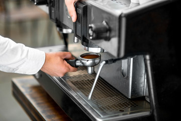 Putting holder to the coffee machine