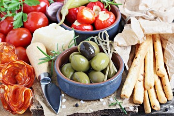 Antipasto appetizer on a wooden table.Selective focus. 