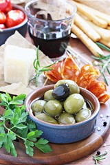 Antipasto appetizer on a wooden table.Selective focus
