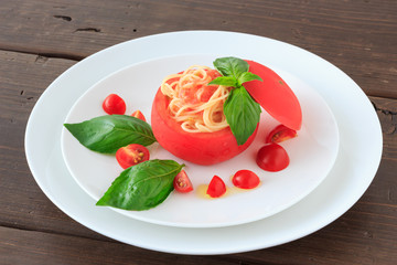 Cold spaghetti in tomato cup