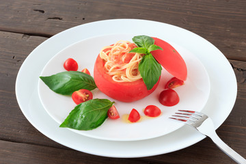 Cold spaghetti in tomato cup