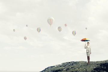 Woman with rainbow umbrella