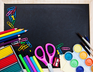 school supplies and blackboard