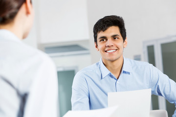Two young people working as partners