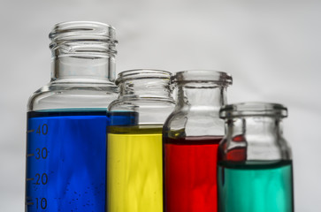 Set of laboratory bottles with color liquid