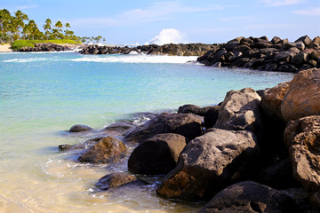 Fototapeta na wymiar Beach shoreline protected by rocks