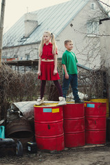 children play at dump drums