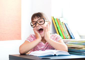 Cute girl is reading book