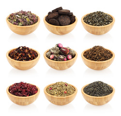 Assortment of dry tea in wooden bowls