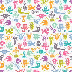 Seamless colorful print with funny monsters.