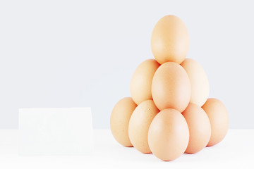 Pyramid of red eggs with a price tag.