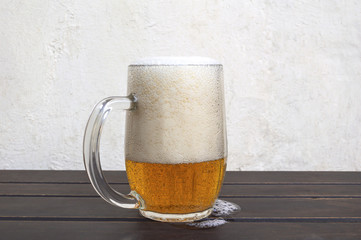 Beer mug on rustic wooden table
