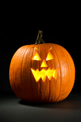 Pumpkin: Spooky Jack-O-Lantern On Black Background
