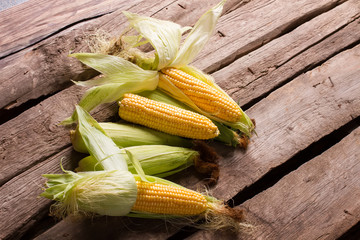 Natural rural corn on the old wooden. © margostock