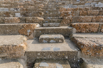 Rows of marble stone seats at ancient Greek theater at Ephesus i