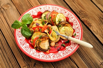 Tasty vegetarian ratatouille made of eggplants, squash, tomatoes